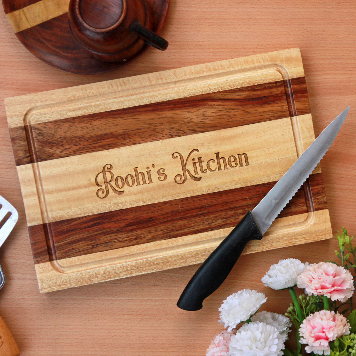 https://www.woodgeekstore.com/cdn/shop/products/personalized-engraved-wooden-chopping-board-my-kitchen--birch-sirish-striped-design-square_1200x.jpg?v=1650553243